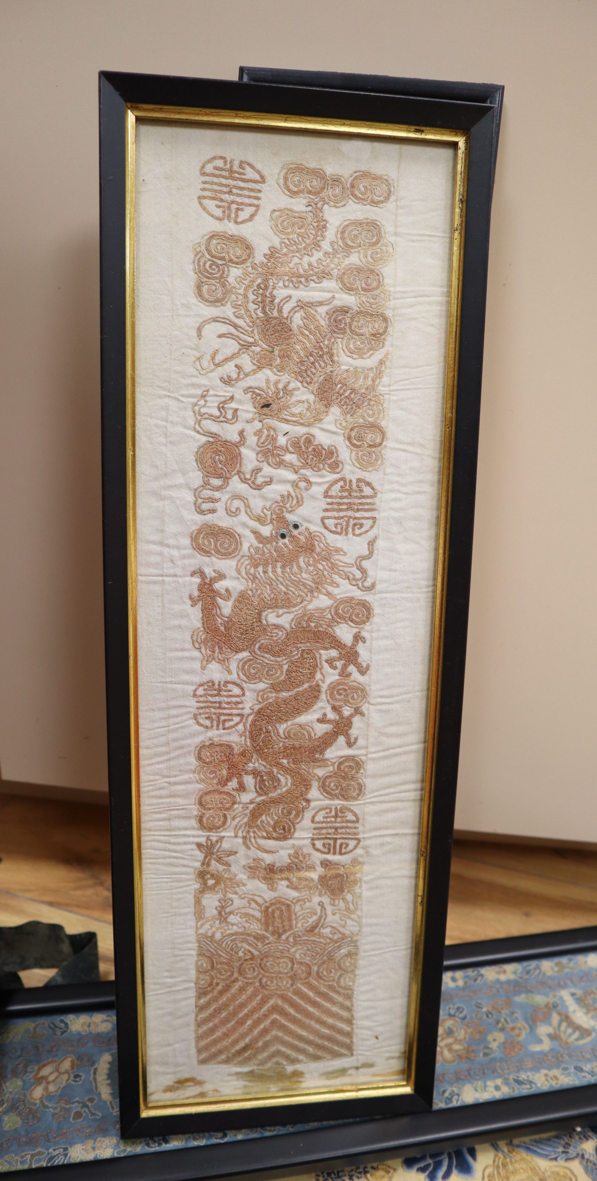 Eleven Chinese embroidered silk sleeve panels, late Qing, framed